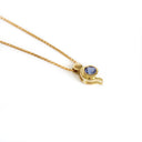Tanzanite Pendant With Yellow Gold Bead and Curve Detail