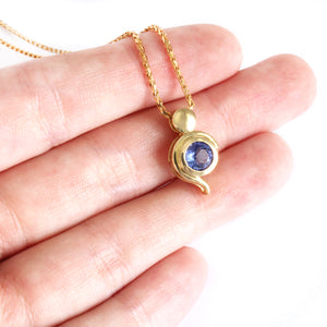 Tanzanite Pendant With Yellow Gold Bead and Curve Detail