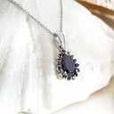 Black Diamond pear cut pendant with black diamond halo