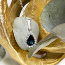 The Perfect Pear Cut Teal Sapphire and Diamond Halo White Gold Pendant