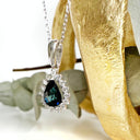 The Perfect Pear Cut Teal Sapphire and Diamond Halo White Gold Pendant