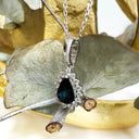 The Perfect Pear Cut Teal Sapphire and Diamond Halo White Gold Pendant