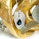 The Perfect Pear Cut Teal Sapphire and Diamond Halo White Gold Pendant