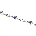 Trilliant Cut Tanzanite And White Gold Loop Bracelet