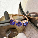 Trilogy Tanzanite Ring with Double Diamond Highlights in Rose Gold