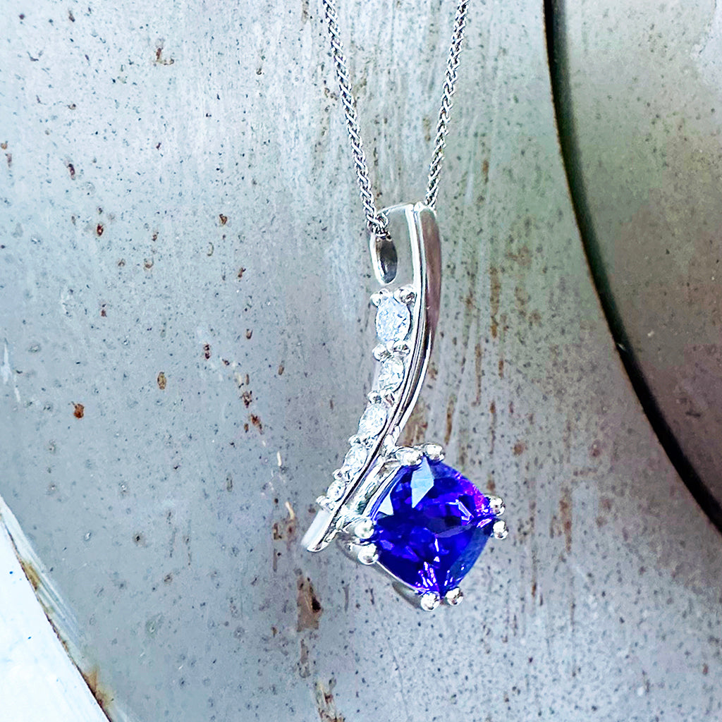 Ultra Glam Cushion Cut Tanzanite and Elaborate Side Sweep White Diamond Bale Pendant