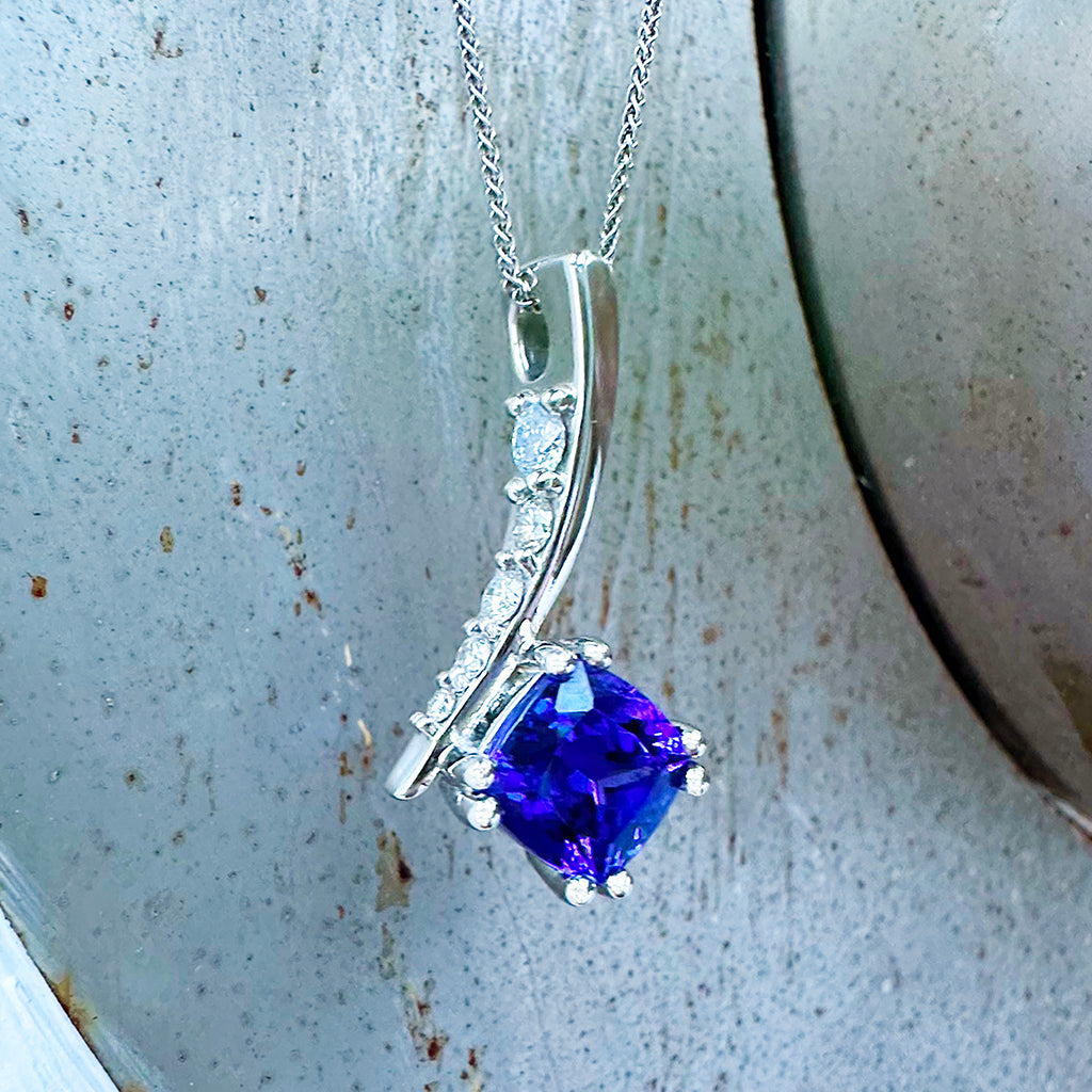 Ultra Glam Cushion Cut Tanzanite and Elaborate Side Sweep White Diamond Bale Pendant