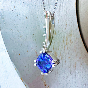 Ultra Glam Cushion Cut Tanzanite and Elaborate Side Sweep White Diamond Bale Pendant