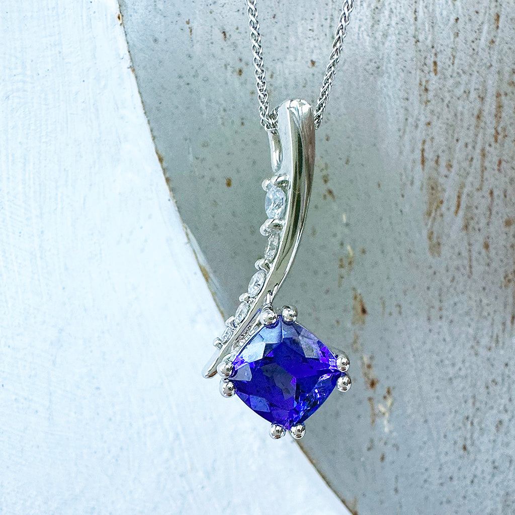 Ultra Glam Cushion Cut Tanzanite and Elaborate Side Sweep White Diamond Bale Pendant