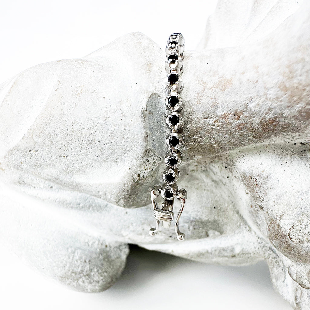 Whimsical White Gold Four Claw Encased Black Diamond Bracelet