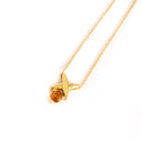 Yellow Gold Four Pointed Star Pendant with Round Cut Citrine
