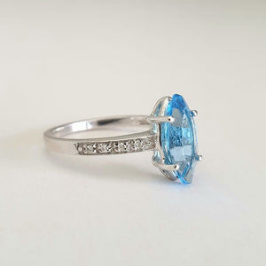 Marquise Cut Blue Topaz White Gold Ring with Diamond Accented Band
