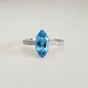 Marquise Cut Blue Topaz White Gold Ring with Diamond Accented Band