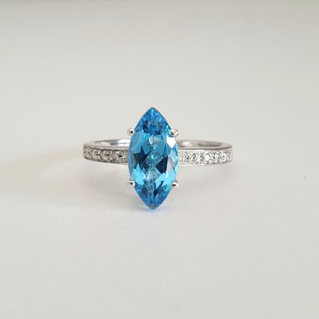 Marquise Cut Blue Topaz White Gold Ring with Diamond Accented Band