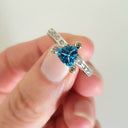 Trilliant Cut Blue Topaz With Diamond Point Accent