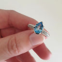 Pear Cut Blue Topaz White Gold Ring with Diamond Band Accent