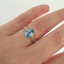 Pear Cut Blue Topaz White Gold Ring with Diamond Band Accent