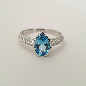 Pear Cut Blue Topaz White Gold Ring with Diamond Band Accent