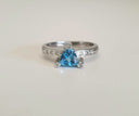 Trilliant Cut Blue Topaz With Diamond Point Accents