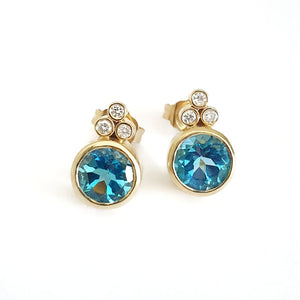 Bezel Set Blue Topaz Earrings With Trilogy Diamond Accent