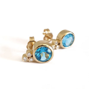 Bezel Set Blue Topaz Earrings With Trilogy Diamond Accent