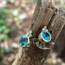 Bezel Set Blue Topaz Earrings With Trilogy Diamond Accent