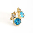 Bezel Set Blue Topaz Earrings With Trilogy Diamond Accent