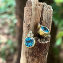 Bezel Set Blue Topaz Earrings With Trilogy Diamond Accent