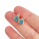 Bezel Set Blue Topaz Earrings With Trilogy Diamond Accent