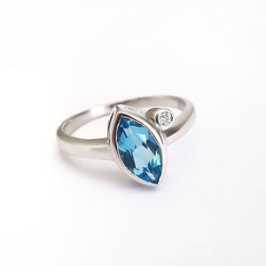 Bezel Set Marquise Cut Blue Topaz And Diamond Ring