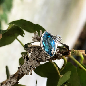 Bezel Set Marquise Cut Blue Topaz And Diamond Ring