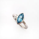 Bezel Set Marquise Cut Blue Topaz And Diamond Ring