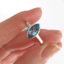 Bezel Set Marquise Cut Blue Topaz And Diamond Ring
