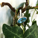 Bezel Set Marquise Cut Blue Topaz And Diamond Ring