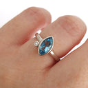 Bezel Set Marquise Cut Blue Topaz And Diamond Ring