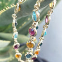 Bezel Set Oval Cut Yellow Gold Rainbow Necklace