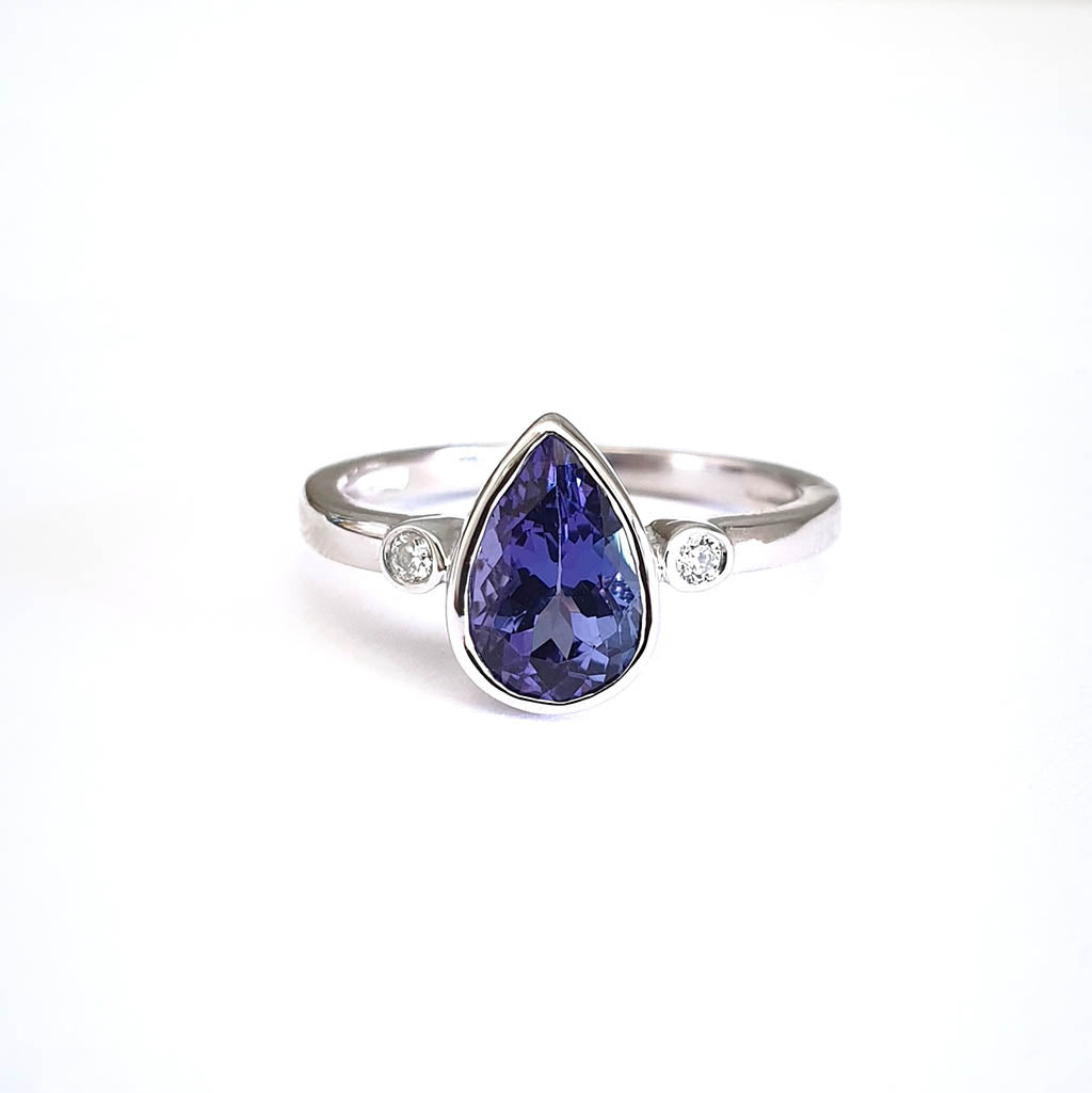 Bezel Set Pear Cut Tanzanite and Diamond Ring