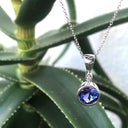 Bezel Set Round Cut Tanzanite and Diamond Pendant