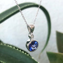 Bezel Set Round Cut Tanzanite and Diamond Pendant