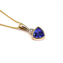 Bezel Set Trilliant Cut Tanzanite and Diamond Yellow Gold Pendant