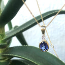 Bezel Setting Oval Tanzanite and Diamond Pendant