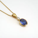 Bezel Setting Oval Tanzanite and Diamond Pendant