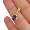 Bezel Setting Oval Tanzanite and Diamond Pendant