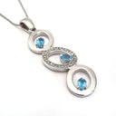 Blue Topaz and Diamond Circle Pendant