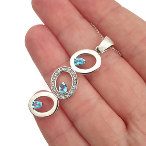 Blue Topaz and Diamond Circle Pendant