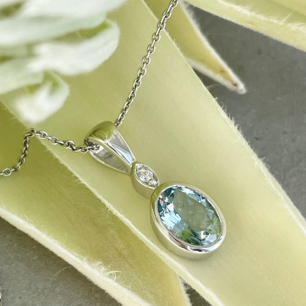 Charming Oval Bezel Set Aquamarine and Diamond Pendant