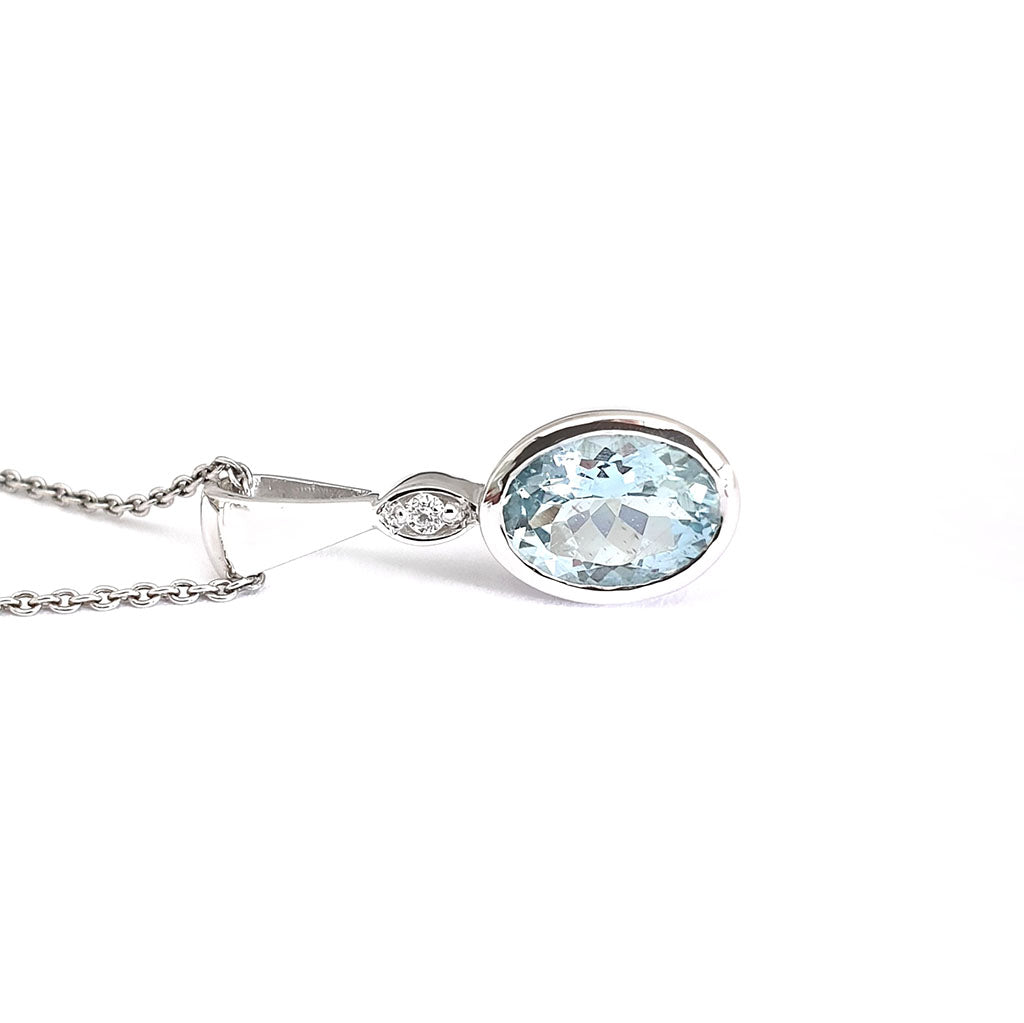  Charming Oval Bezel Set Aquamarine and Diamond Pendant