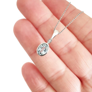  Charming Oval Bezel Set Aquamarine and Diamond Pendant