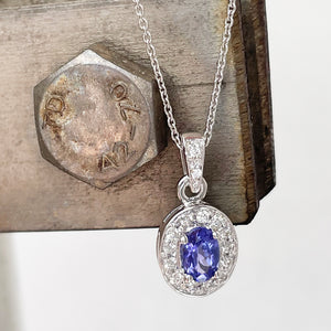 Classically Elegant Oval Tanzanite and Diamond Halo Pendant