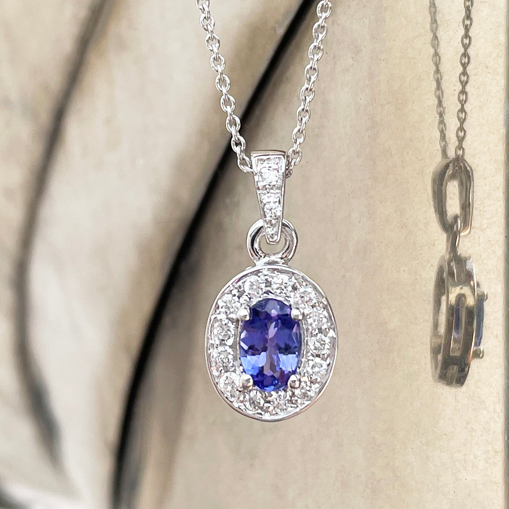 Classically Elegant Oval Tanzanite and Diamond Halo Pendant